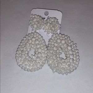White bead earrings.